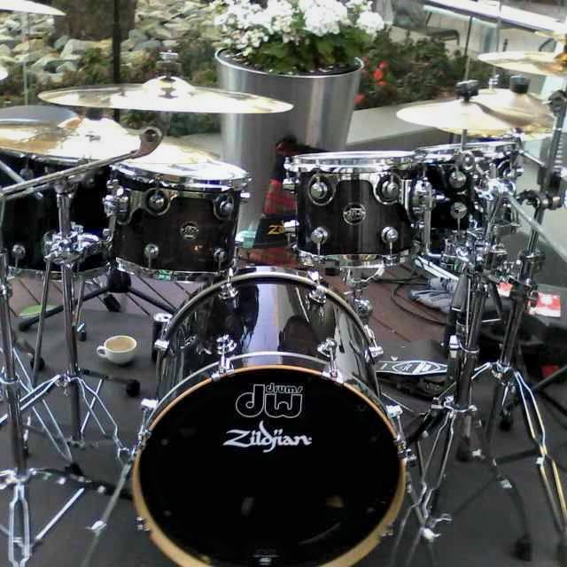 DW kit with Zildjian cymbals featuring branded bass drum head