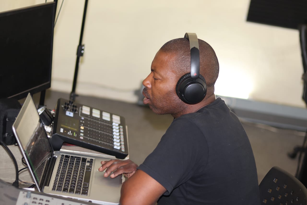 Sipho monitoring a session at the studio console