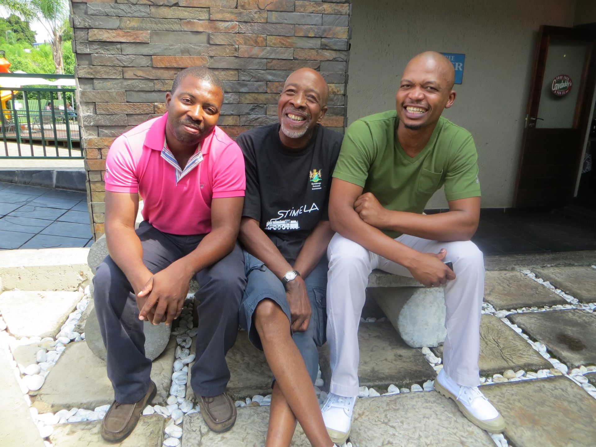 Sipho with fellow musicians outside a venue