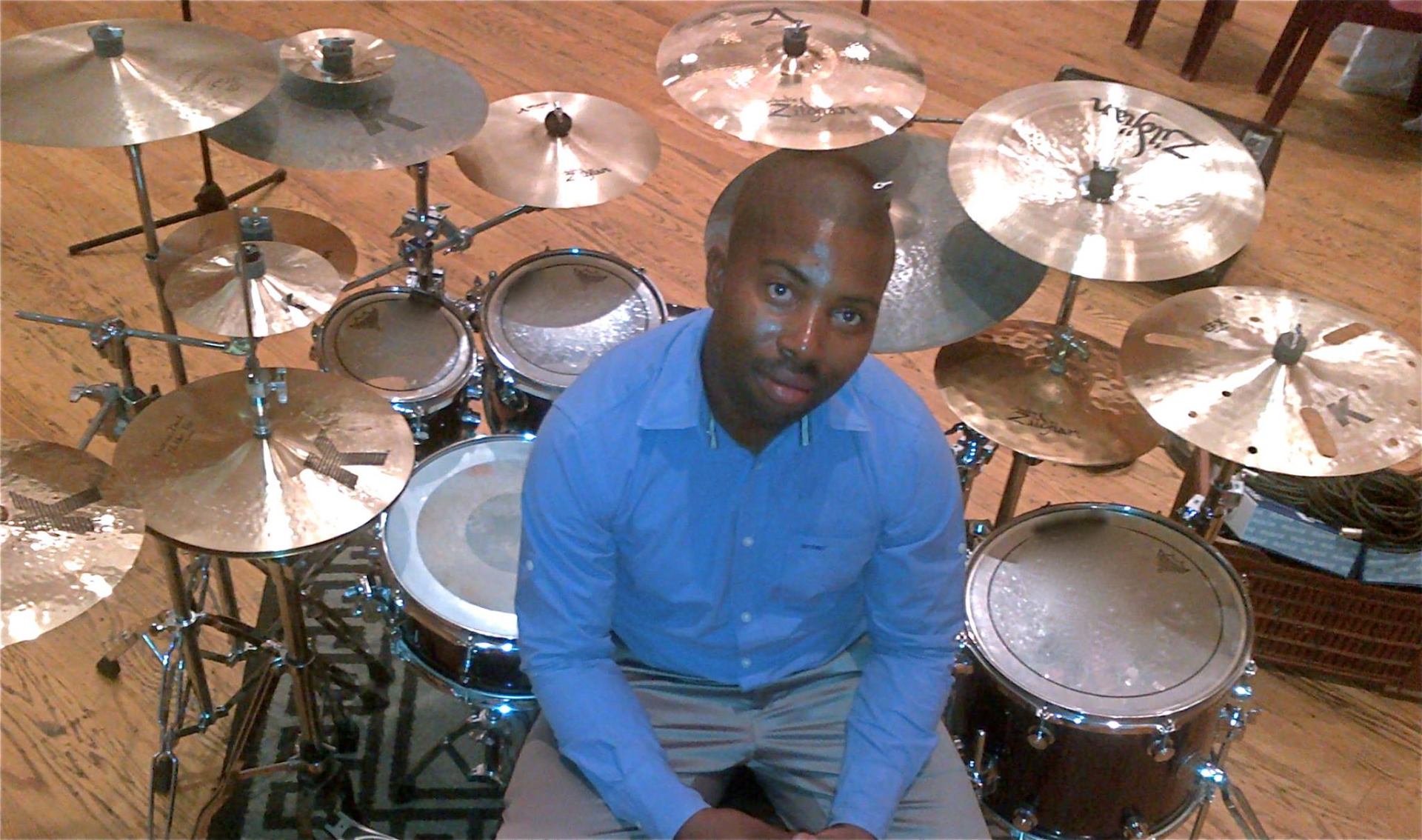 Sipho seated behind a full Zildjian K cymbal setup
